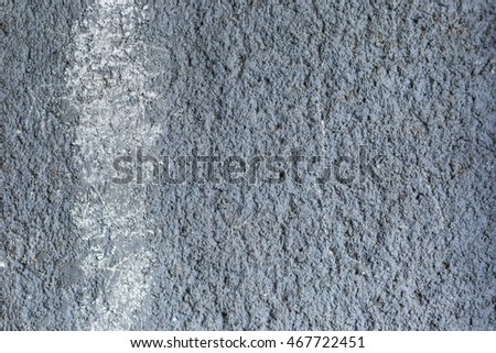 texture of a blue stone wall with a white stripe. enough space for text, lettering and copy.