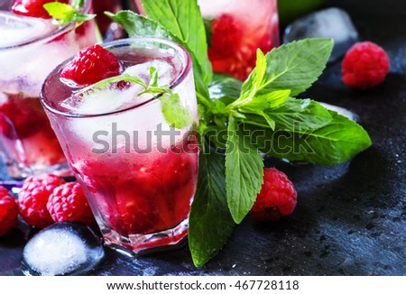 Alcohol mojito cocktail with raspberries, selective focus