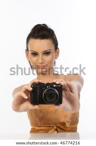 Teenage girl with digital camera