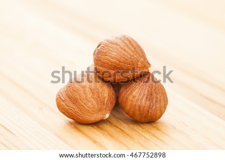 Hazelnuts on wooden background
