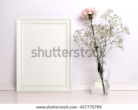White frame mockup with flowers. Poster product design styled