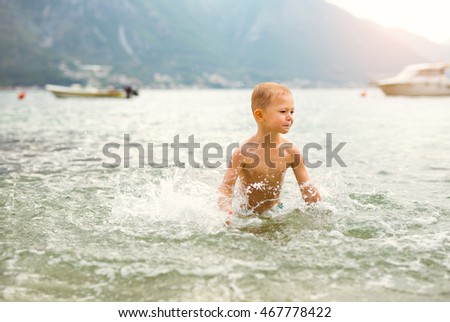 Children playing in the sea.