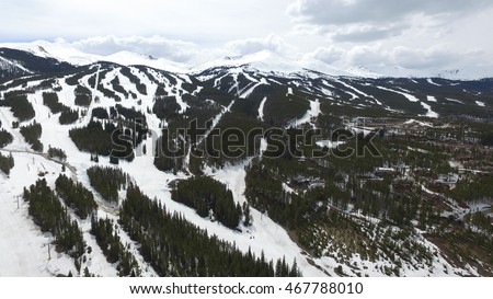 Aerial of Colorado mountains with snow in the winter time