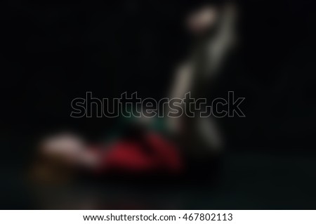 Contemporary dancer wearing red performance abstract blur background with shallow depth of field