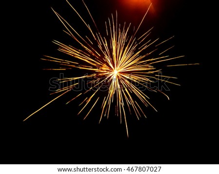  Colorful fireworks on the black sky background. Holiday celebration.