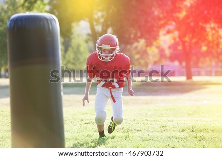 Youth football player practicing Royalty-Free Stock Photo #467903732