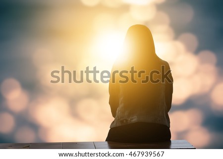 Lonely woman sitting alone moments sunset.are Lovely. Style abstract shadows.silhouette. On Blurred background bokeh. light Fair. Let's Stay Together Royalty-Free Stock Photo #467939567