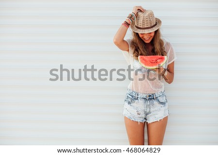 young pretty women holding a slice of watermelon in hands and smiling happy, summertime concept and mood, over an white background with lines