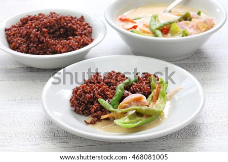 ema datshi (traditional chili cheese stew) with red rice,bhutanese cuisine Royalty-Free Stock Photo #468081005