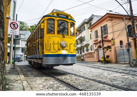 Iconic bonde tram traveling along the streets of the tourist nieghborhood of Santa Teresa in Rio de Janeiro, Brazil 
