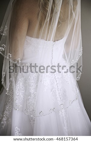 Bride in wedding dress back