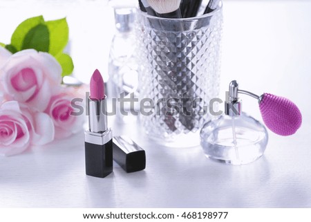 Opened lipstick on white dressing table