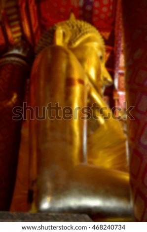 Blurred abstract background of Buddha statue
