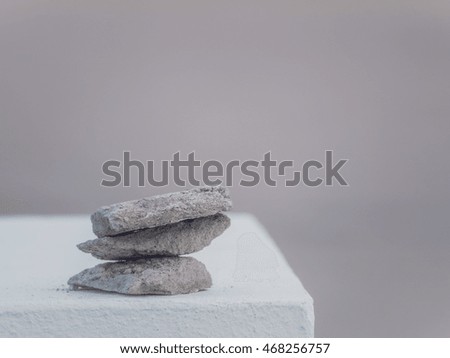 Three rough stones placed on top of each other