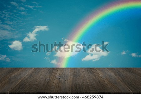 Nature cloudscape with blue sky and white cloud with Wood terrace and rainbow , process in vintage style