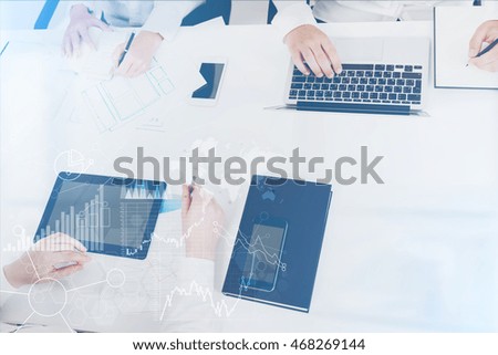 Business people working together. Concept of collaboration. Toned image. Double exposure. Elements of this image furnished by NASA