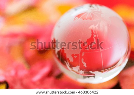 red falling leaves and globe