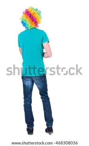 back view of dancing young beautiful  man  in clown wig.  Rear view people collection.  backside view of person.  Isolated over white background. Curly man in a turquoise sweater and clown wig