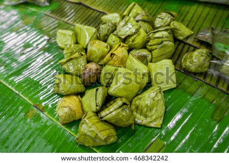 The Thailand sweet wrapped by banana leaf in the local market. 