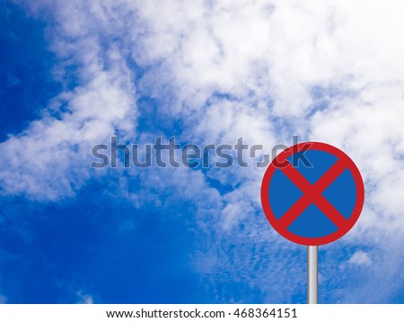 Round Clearway (No stopping) transportation sign on blue sky with white cloud background
