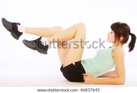 Young happy woman doing fitness