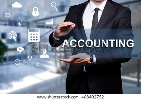 White text with icon "Accounting" in the hands of a businessman. Business concept. Internet concept.