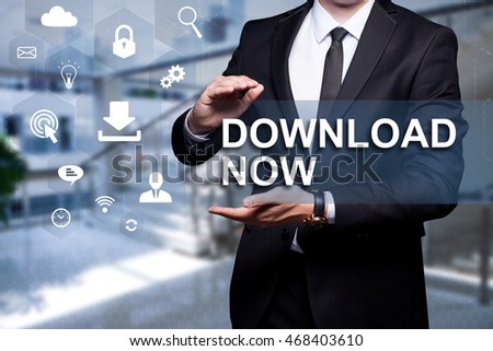 White text with icons "Download NOW" in the hands of a businessman. Business concept. Internet concept.