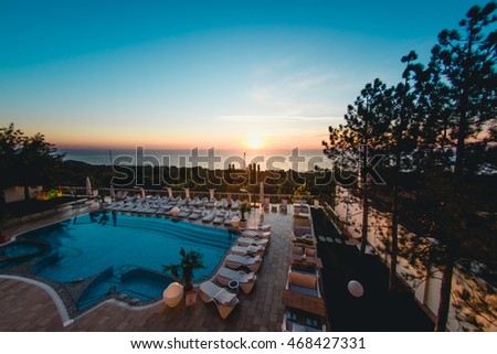 Beautiful luxury pool in hotel  Royalty-Free Stock Photo #468427331
