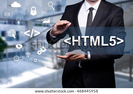 White icon with text "<HTML5>" in the hands of a businessman. Business concept. Internet concept.