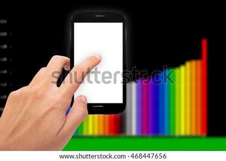 Hand holding smartphone with white screen and representing business growth with colorful business chart  background.