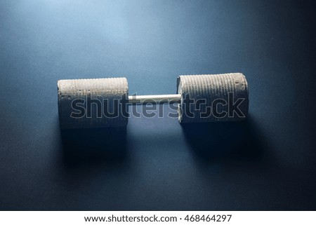 selfmade rusty dumbbell on black background