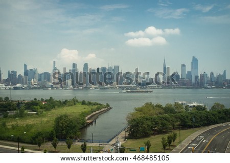 Beautiful New York City skyline against summer blue sky 