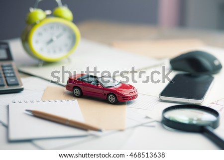 Car,magnifier,calculator  and documents,car for rental