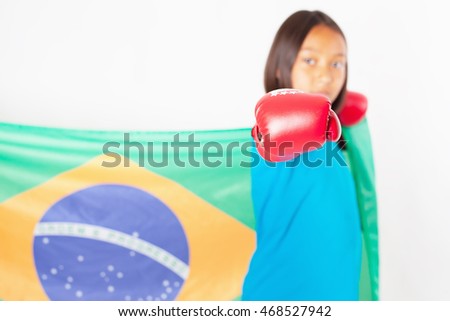 Brazilian patriot and fan girl holding Brazil flag. Brazilian boxing championship. Wearing a boxing gloves. Boxer. Battle. White background