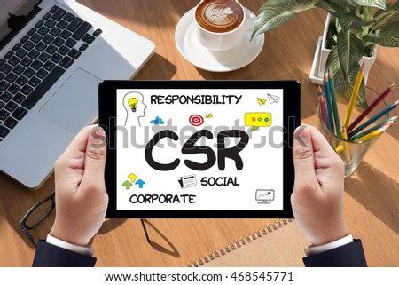 Corporate  Social Responsibility CSR and   Sustainability Responsible Office  CSR Businessman work  on tablet on screen