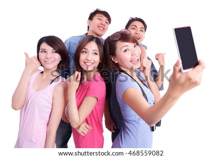 Happy teenagers taking pictures by themselves isolated on white background, asian