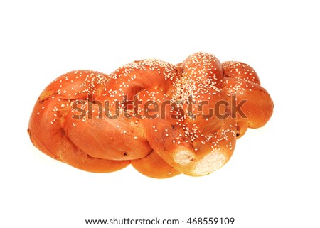 Bright shabbat challah with seeds isolated on white background