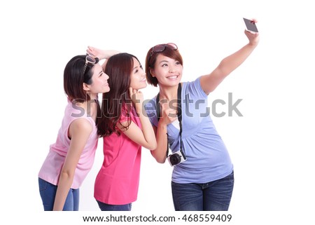 Happy teenagers woman taking pictures by themselves isolated on white background, asian
