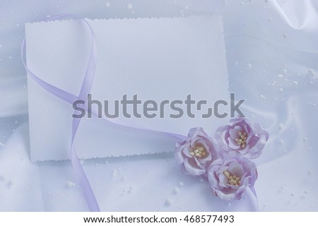 Template wedding greeting cards. Satin ribbons and flowers on a white background.
