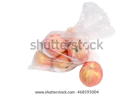 The heap of red apples packed in plastic film on white background with clipping path