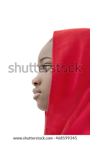 Lovely girl wearing a red headscarf, side view, isolated 