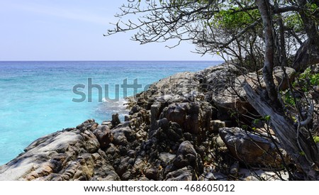 Clear sea water with rock foreground