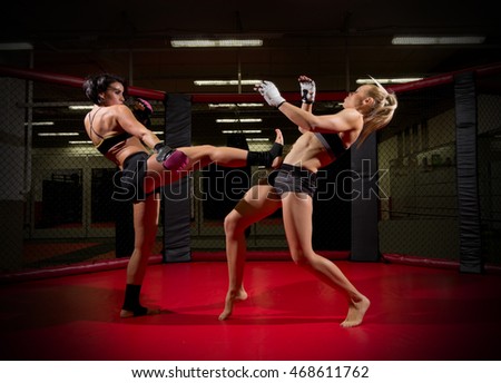 Two wrestler women in sports hall