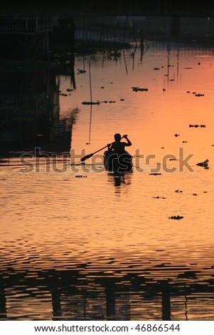 Sunset over a lake, Bangkok, Thailand.