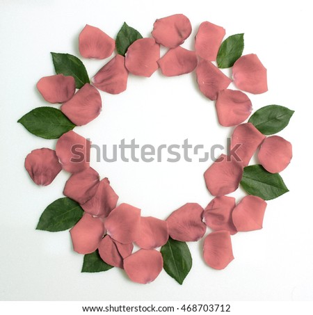 round floral frame of pink rose petals with green leaves Royalty-Free Stock Photo #468703712