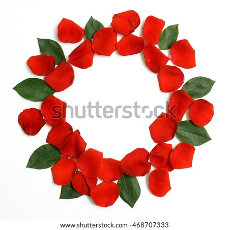 round floral frame of red rose petals with green leaves Royalty-Free Stock Photo #468707333
