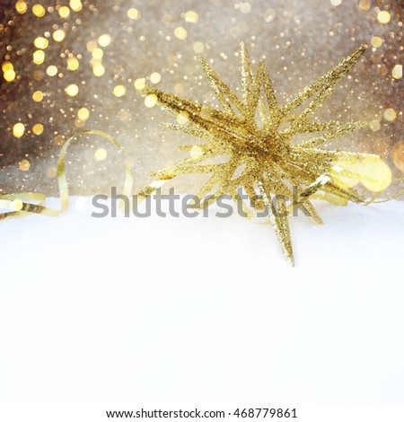 Golden christmas star in snow