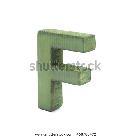 Single sawn wooden letter F symbol coated with paint isolated over the white background