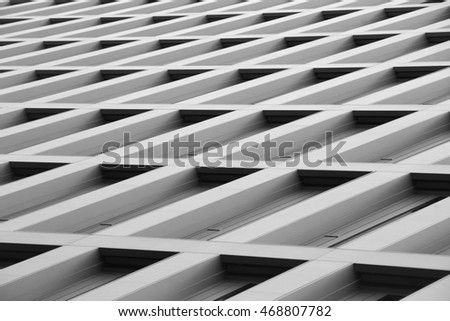 Abstract architecture photo taken from extremely low angle. Concrete cellular / modular structure. Contemporary office building. Diagonal composition with perspective. Royalty-Free Stock Photo #468807782
