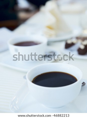 Soft-focused cup of morning black coffee, cold tones